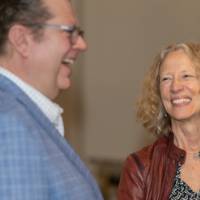 Provost Drake smiles during a conversation with Clayton